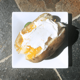 baked potato with cheese and sour cream