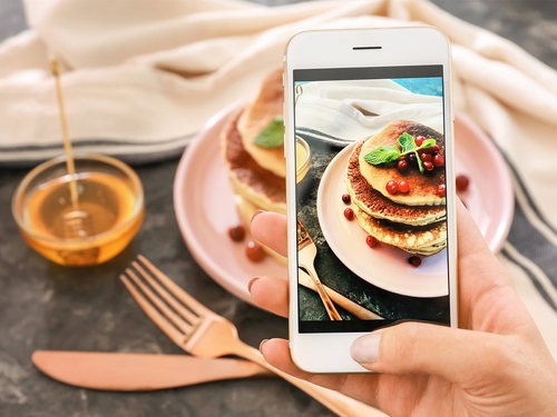 Taking a photo of food for social media