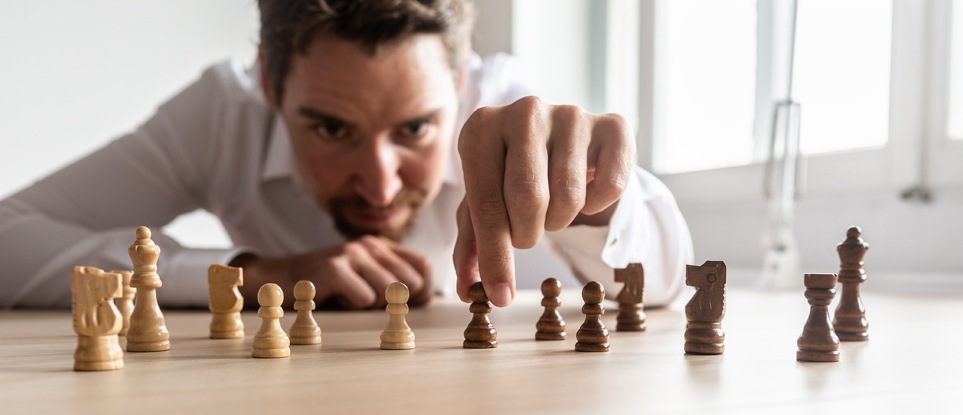 man playing chess with strategy