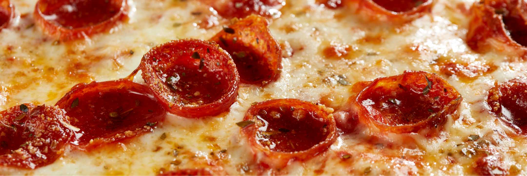 Close up photograph of cooked pizza for Legit Pizza by Element